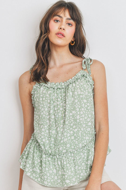 Top sin mangas con peplum fruncido y detalle de volantes