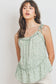 Top sin mangas con peplum fruncido y detalle de volantes