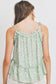 Top sin mangas con peplum fruncido y detalle de volantes